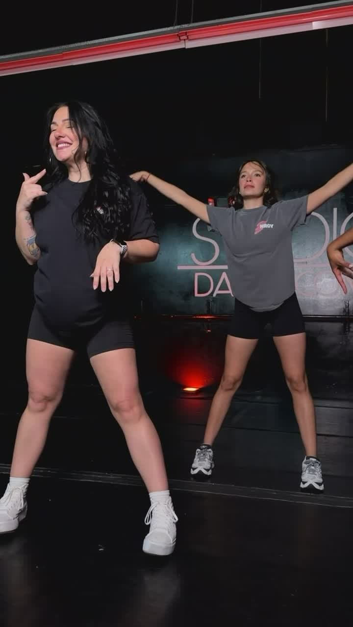 Nat and Lu dancing under the red lights