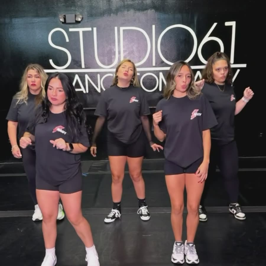 The team lined up mid-routine at the studio